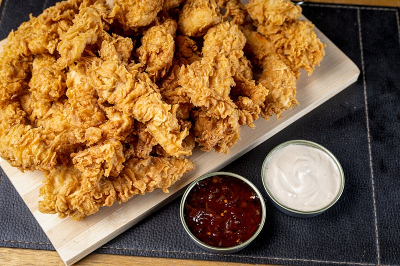 Spicy Nashville hot chicken tenders with cayenne crust